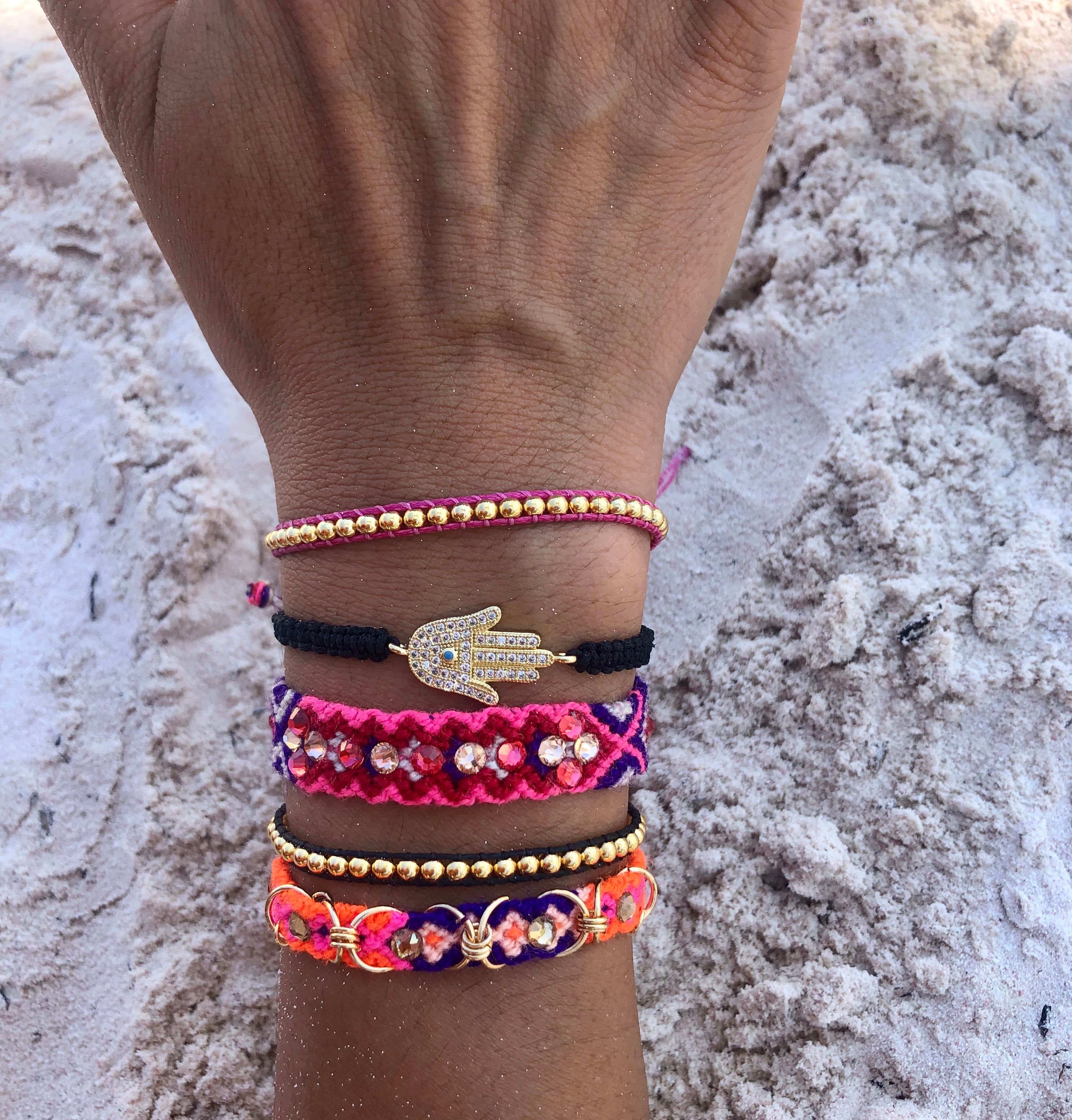 Pulsera Gold Power. Color Fuccia